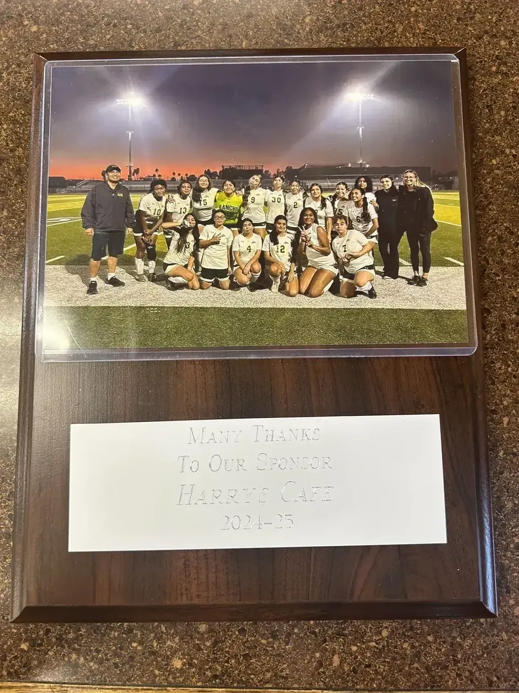 A sponsorship plaque from Rancho Alamitos High School thanking Harry’s Cafe, Katella Ave, Stanton, CA