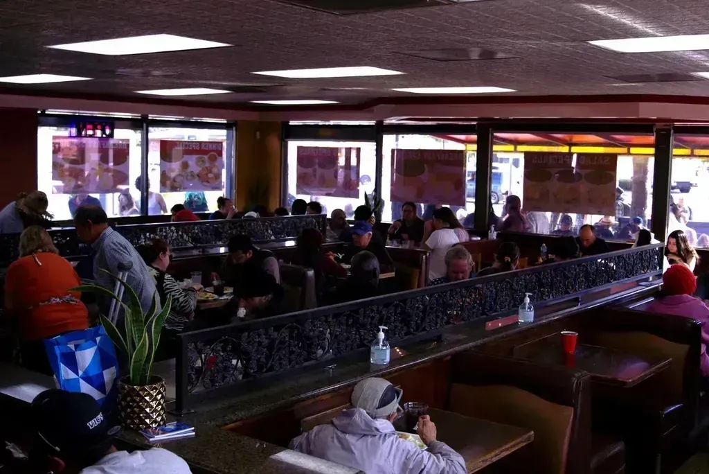 A packed dining room during the free Thanksgiving dinner at Harry's Cafe, Katella Ave, Stanton, CA