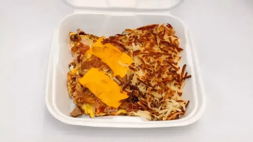 A bacon and cheese omelette with hash browns in a to-go container at Harry's Cafe, Katella Ave, Stanton, CA