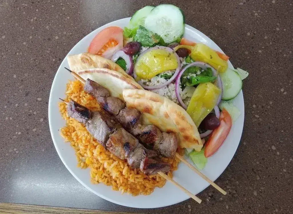 A beef kebob plate with rice, pita, and a Greek salad at Harry's Cafe, Katella Ave, Stanton, CA