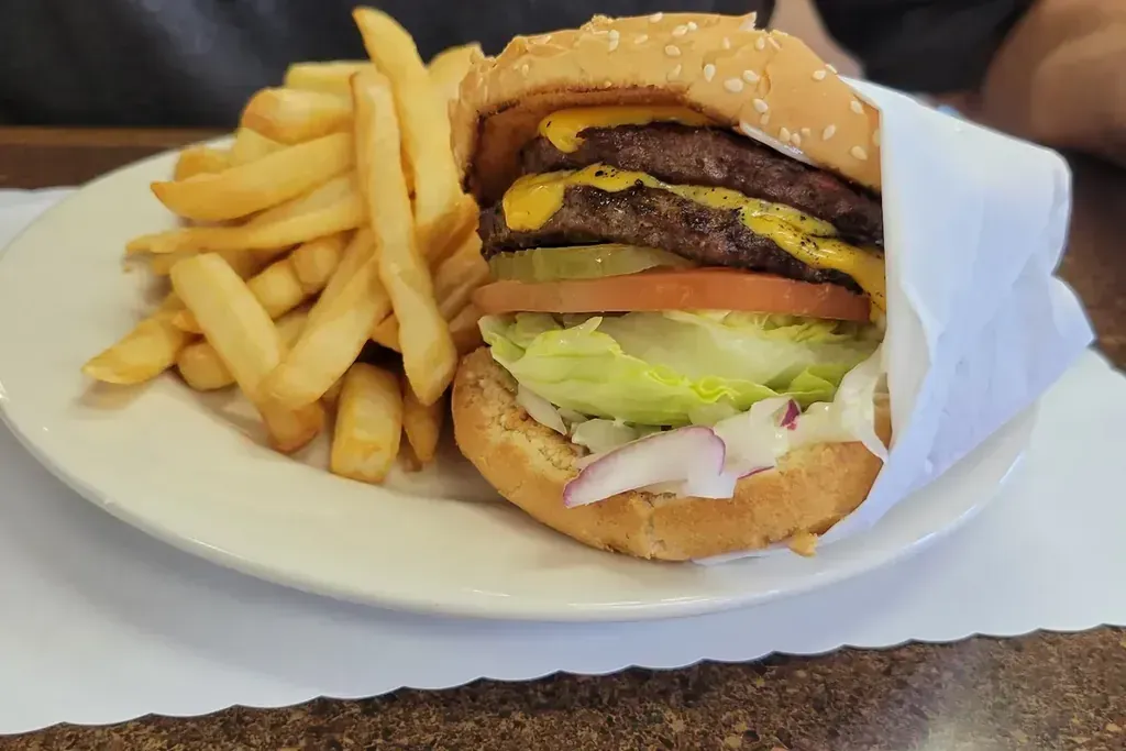 A double cheeseburger with fries at Harry's Cafe, Katella Ave, Stanton, CA