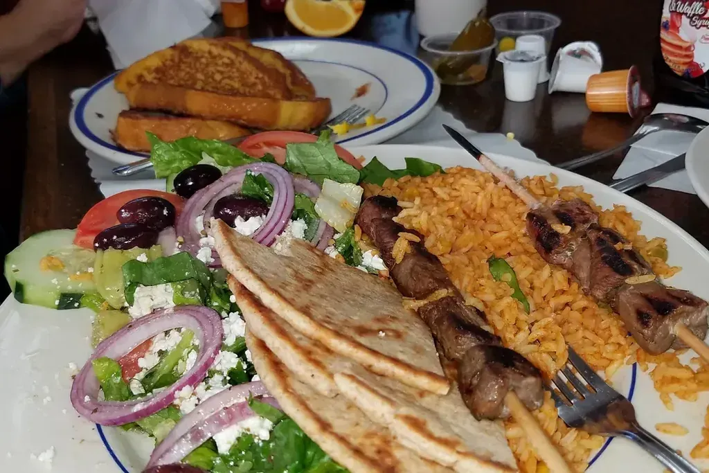 A Greek kebob plate with pita, rice, and salad at Harry’s Cafe, Katella Ave, Stanton, CA.