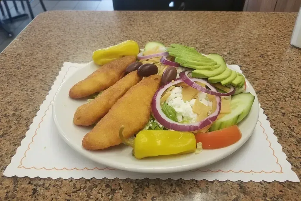A breaded fish plate with a side salad at Harry's Cafe, Katella Ave, Stanton, CA