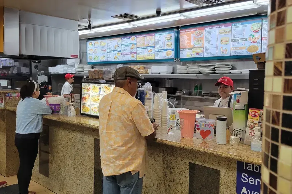 Guests ordering at the front counter at Harry’s Cafe, Katella Ave, Stanton, CA.