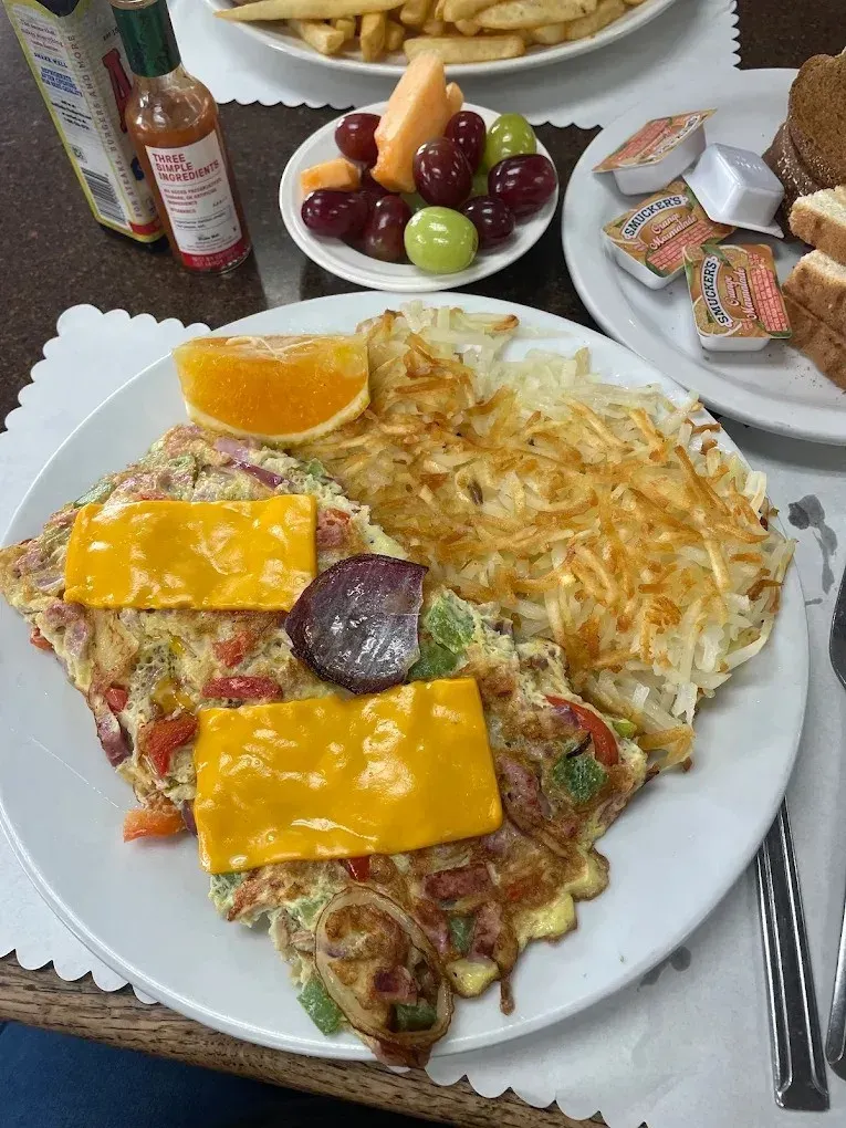 A cheese omelette with hash browns and a fruit cup at Harry's Cafe, Katella Ave, Stanton, CA