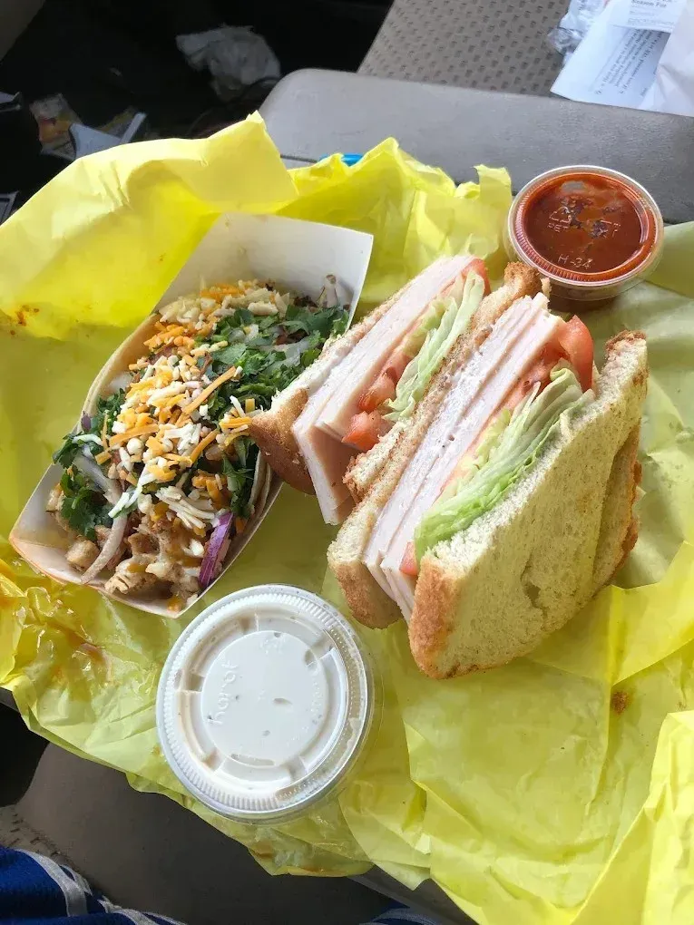 A club sandwich and a salad in a takeout box at Harry's Cafe, Katella Ave, Stanton, CA