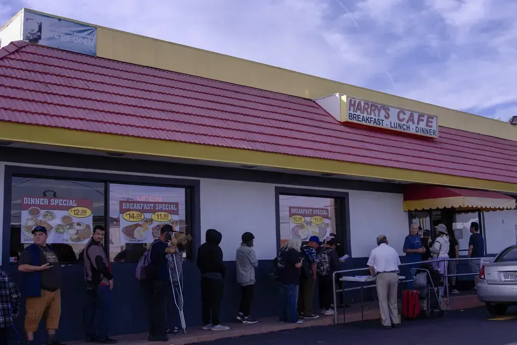 A line of customers outside the storefront at Harry's Cafe, Katella Ave, Stanton, CA