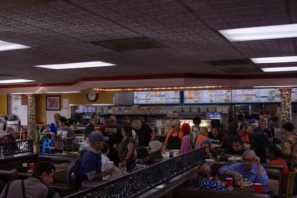A busy dining room full of guests at Harry's Cafe, Katella Ave, Stanton, CA