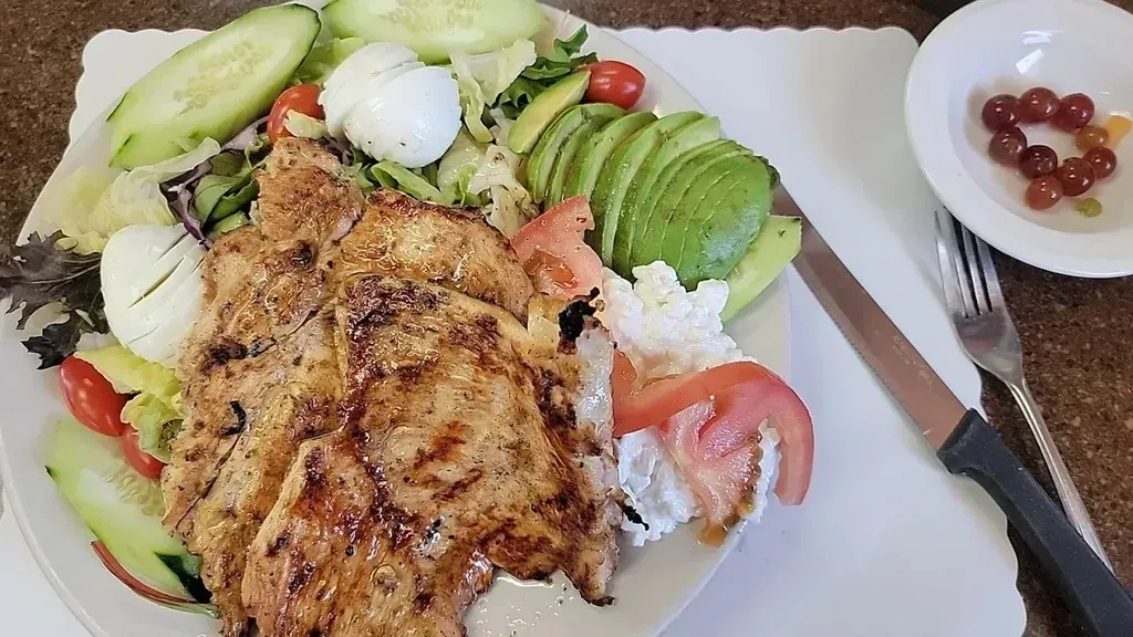 A grilled chicken salad with avocado, tomato and cottage cheese at Harry's Cafe, Katella Ave, Stanton, CA