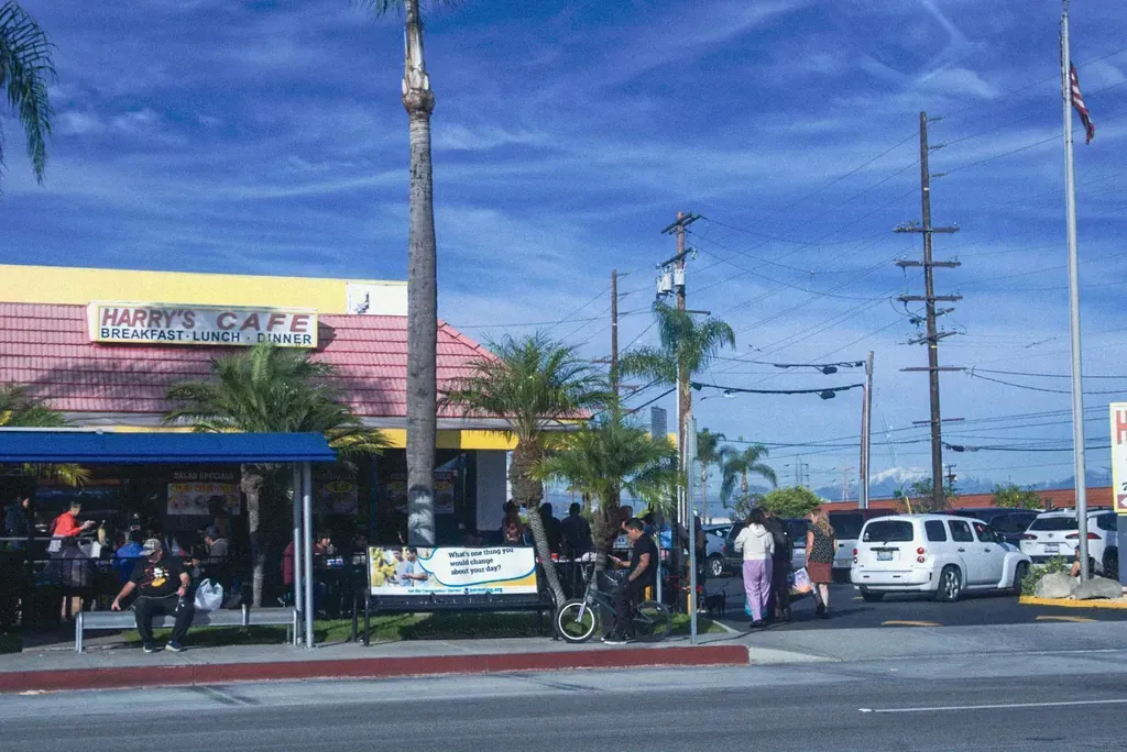 The storefront and drive-thru sign seen from Katella Avenue across the street at Harry's Cafe in Stanton