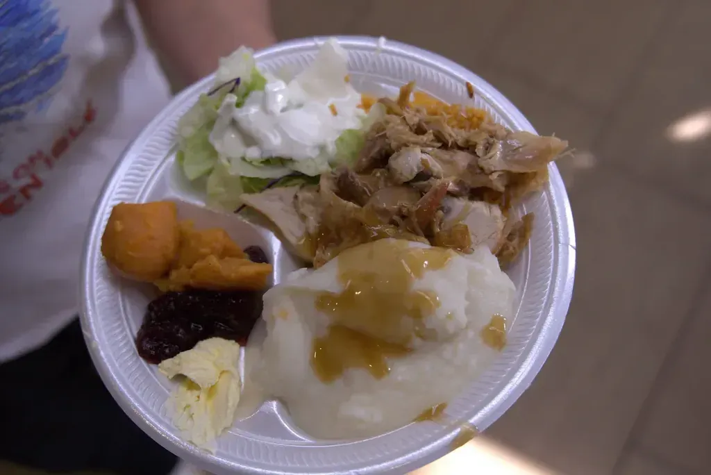 A Thanksgiving plate with turkey, mashed potatoes with gravy, yams and cranberry sauce at Harry's Cafe, Katella Ave, Stanton, CA