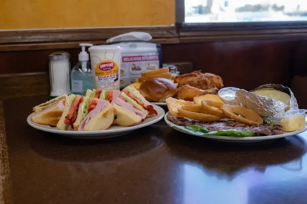 Club sandwiches and combo plates lined up on the counter at Harry’s Cafe, Katella Ave, Stanton, CA.